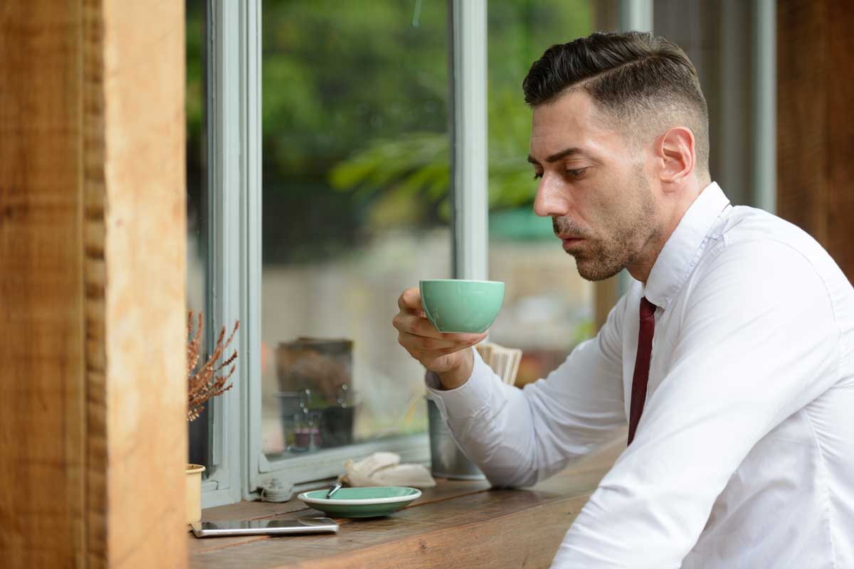 Profile View Of Handsome Businessman At The Coffee